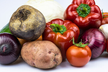 An assortment of vegetables isolated on a white background.