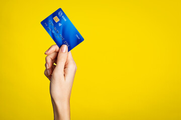 Female hand holding bank credit card - 431495453