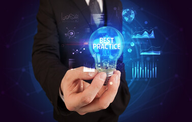 Businessman holding a light bulb, new business concept