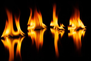 Fototapeta premium fire flame with reflection in the glass on a black background