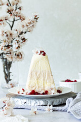 Cheese Easter cake with cherry and apricot flowers 
