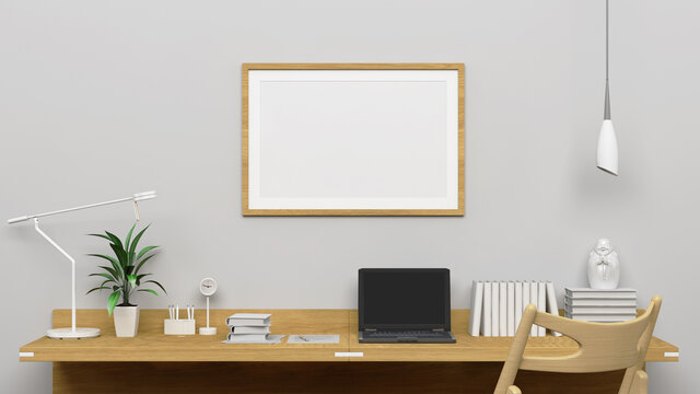 Horizontal frame mockup on the empty white wall with modern work desk interior.