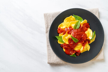 Ravioli with tomato sauce and basil