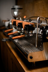 Fototapeta na wymiar close-up view on row of modern professional coffee machines in coffee shop