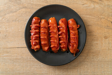 deep fried sausage skewer on plate