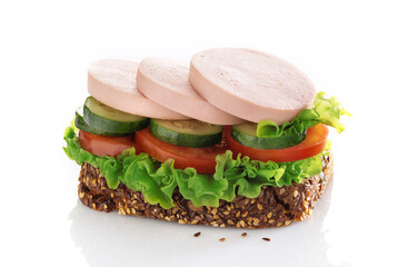 Sandwich with sliced sausage and vegetables isolated on a white background.