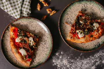 Handmade lamb pizza with pesto sauce.