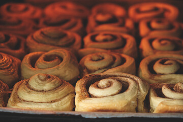 Cinnamon rolls are baked in oven, homemade cakes.