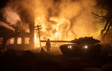 Fototapeta premium War Concept. Military silhouettes fighting scene on war fog sky background, World War Soldiers Silhouette Below Cloudy Skyline At night. Battle in ruined city.