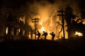 War Concept. Military silhouettes fighting scene on war fog sky background, World War Soldiers Silhouette Below Cloudy Skyline At night. Battle in ruined city. Selective focus