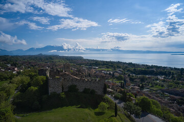 Obraz premium Aerial view of the historic part of Padenghe Castle on Lake Garda, Italy. Top view of the castle. Panorama of Lake Garda. Historic castles in Italy. Tourist places.