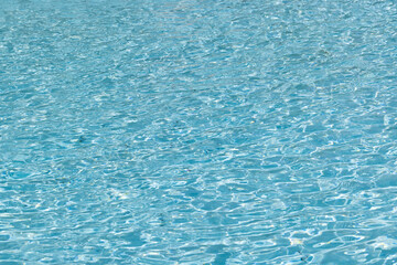 blue water background. Top view of the water in the pool