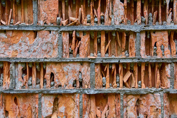 old red destroyed bricks in the wall close-up