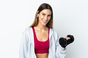 Young sport woman over isolated background making weightlifting