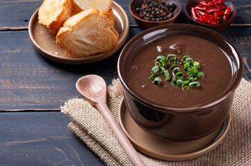 .Delicious dish of Brazilian cuisine called Caldo de Feijão. Made with black beans, bacon and sausage.