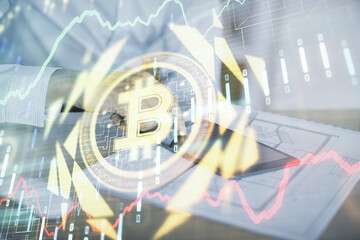 Double exposure of man's hands holding and using a phone and crypto currency blockchain theme...