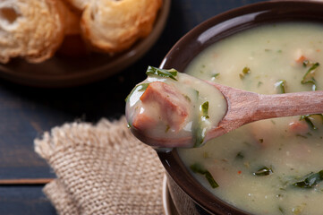 .Delicious dish of Portuguese cuisine called Caldo Verde. Made with potatoes, cabbage, bacon and sausage