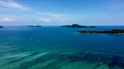 Naklejka na ściany i meble Tropical islands and blue water, drone footage