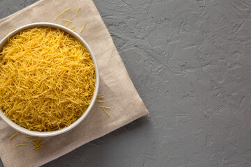 Raw Dry Filini Vermicelles Ready to Cook, top view. Overhead, from above, flat lay. Space for text.