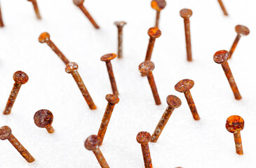 Old nails head set, Rusty nail from different perspectives on a white background.	