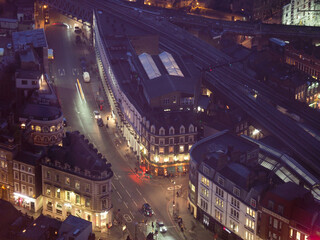 night time picture of London street looking down from the Shard 