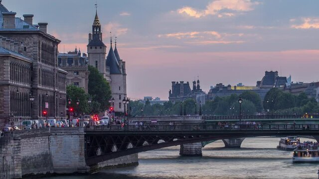 Le Pont D'Arcole bridge after sunset with people and boats day to night timelapse, Paris, France, Europe