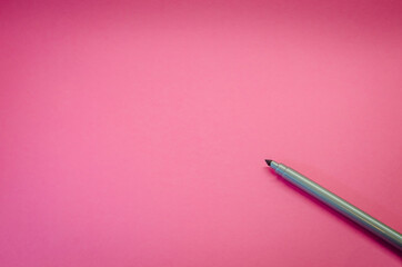 Metallic marker or felt-tip pen isolated on pink background. Drawing and hobby concept. Top view with copy space