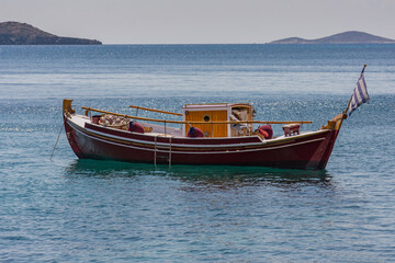Naklejka na ściany i meble A fully refurbished Greek traditional boat.