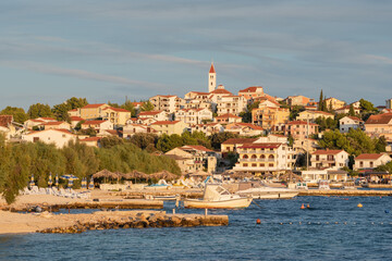 Fototapeta na wymiar Small Mediterranean town Seget Donji near the Trogir town at sunset, Croatia
