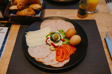 The healthy delicious breakfast served on the table in the cafe. Top view of healthy delicious breakfast served on the table in the cafe.