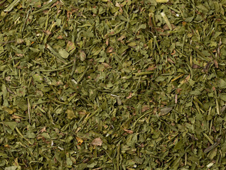 Top view, closeup of dried parsley. Food backdrop