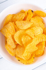 potato chips in a white bowl