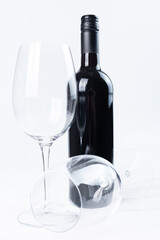 Wine bottle and glasses on white background