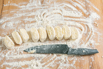 Woman preparing dough. Raw dough