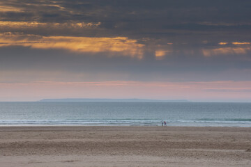Fototapeta na wymiar Golden Sunset on the beach of Woolacombe in Devon, England.