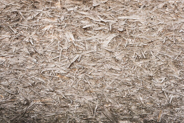 Wooden vertical background with pronounced texture. Brown vertical planks solid wood knots and cracks. The micro-texture of the tree is a pronounced relief.