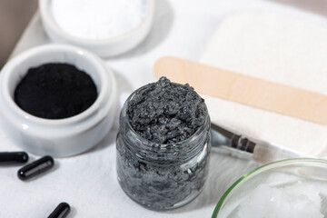 Ingredients for a homemade charcoal facial mask.