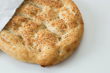 Turkish Ramadan Pide  bread on the whit background.
