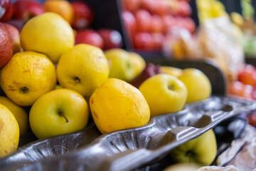 Close-up of colorful fruit stand with apples, and more
