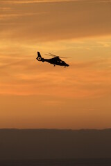 Fototapeta na wymiar helicopter in the sunset