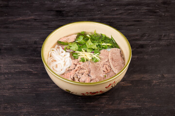 noodle meat and chopped green soup
