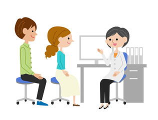 診察室で女医に説明を受ける若い夫婦