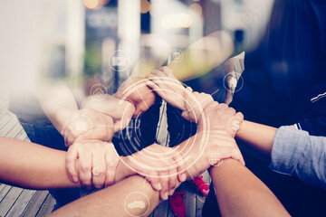 Close-up of the hands of people of different races, contracting trust and cooperation.