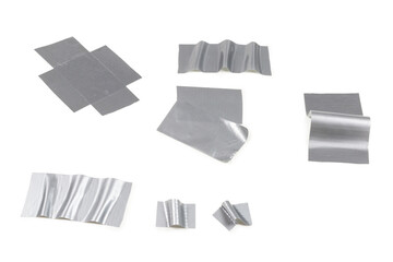 Silver scotch tape pieces isolated on white background.