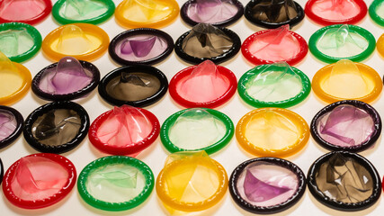 Colorful condoms background.