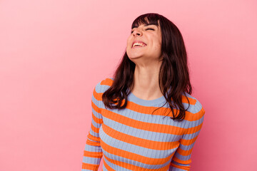 Young caucasian woman isolated on pink background relaxed and happy laughing, neck stretched showing teeth.