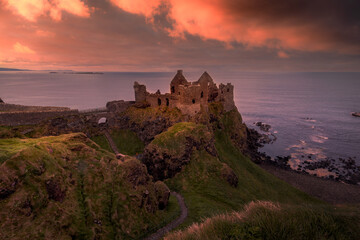 view of Dunluce Castle in Northern Ireland at sunset. Portrush. United Kingdom