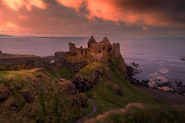 Obraz premium view of Dunluce Castle in Northern Ireland at sunset. Portrush. United Kingdom