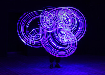 Light show in darkness entertainment neon glow circles performance