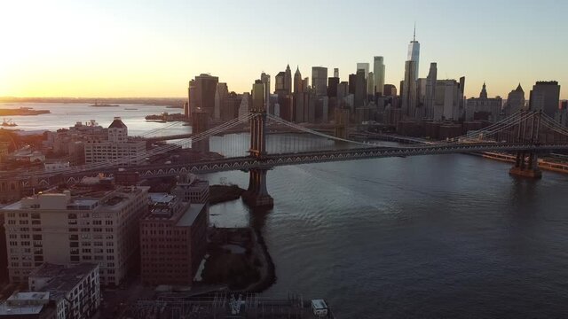 2020 - Beautiful aerial over lower Manhattan New York, Brooklyn Bridge, Manhattan Bridge and East River.